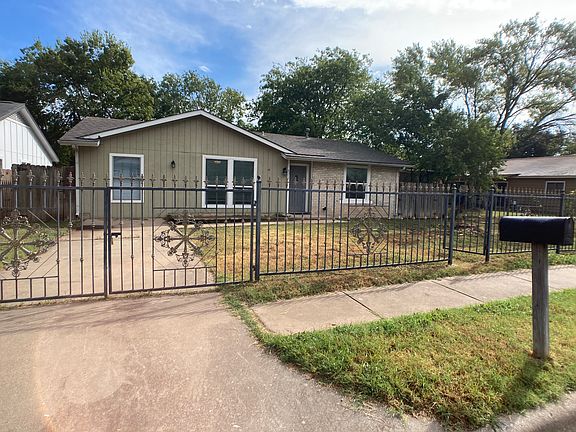 Gated driveway and front yard