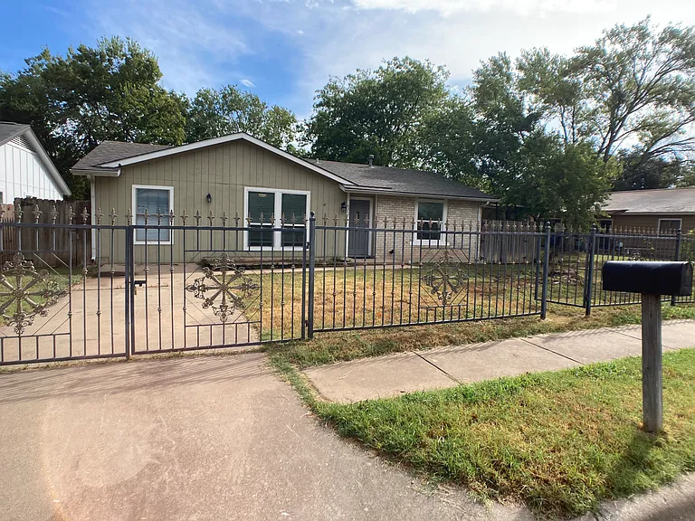 Gated driveway and front yard
