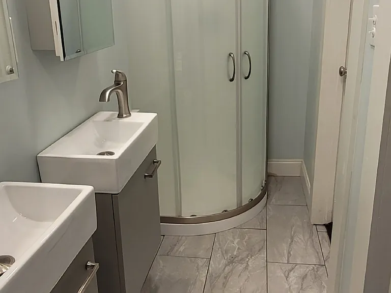 Second bathroom with two sinks. Entry to bathroom from back and master bedrooms.
