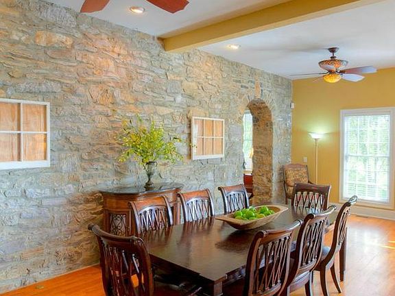 Dining Room has orig exterior stone wall