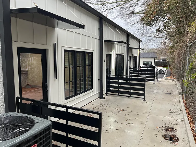 Alley on north side of building including patios for units 5, 7, 9, and 11