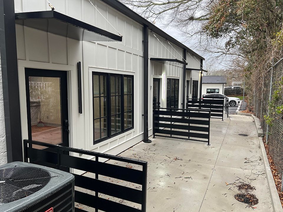 Alley on north side of building including patios for units 5, 7, 9, and 11