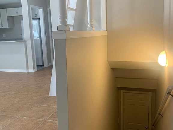 Stairs leading to laundry room shared with downstairs unit