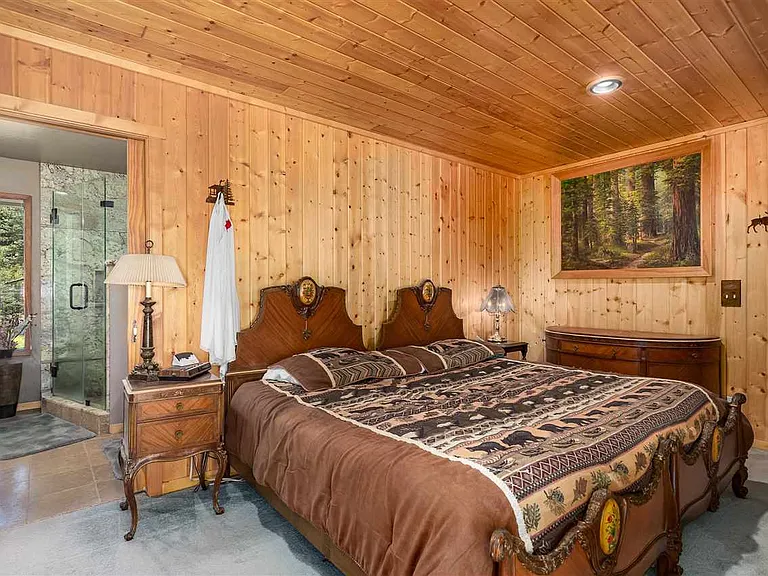 Primary bedroom with en-suite bathroom and private deck access
angle 1