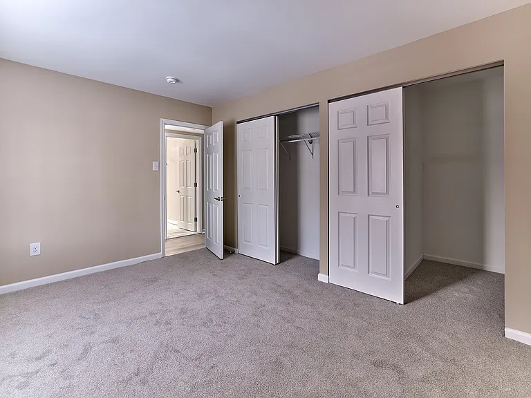 Spacious primary bedroom with generous double closets in this 2 bedroom, 2 bathroom apartment at North Crossing in Willow Grove, PA.