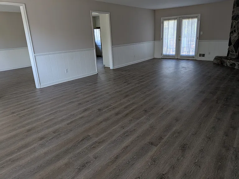 Living room with fireplace and access to the deck