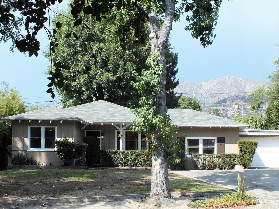 Front of home with large new driveway