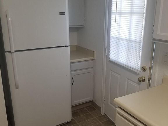 Kitchen - refrigerator and back door - Main Level