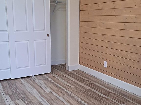 Bedroom with over-sized double door closet.