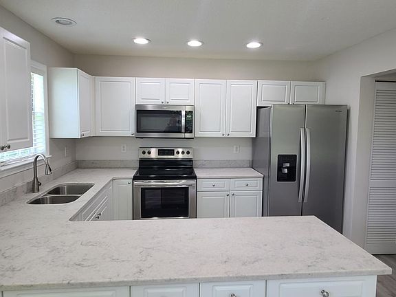 New appliances, double bowl sink and new quartz countertops.