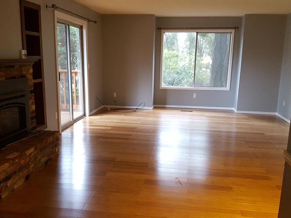 Living Room with gas fireplace and deck