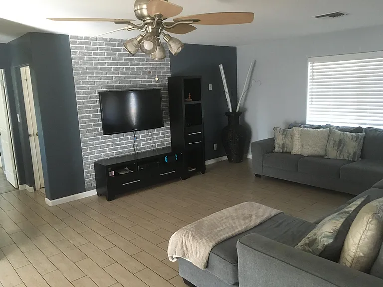Large living room opens to the dining room and kitchen.