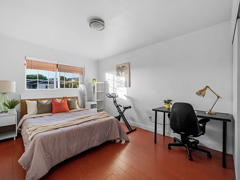 A cozy all-in-one retreat _ sleep, work, and workout in one stylish space.