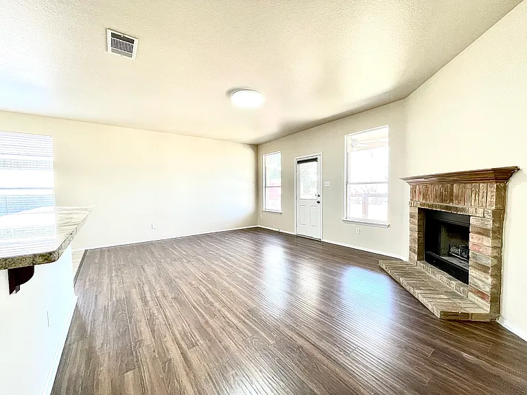 Living room with a great view of the back yard, a fireplace