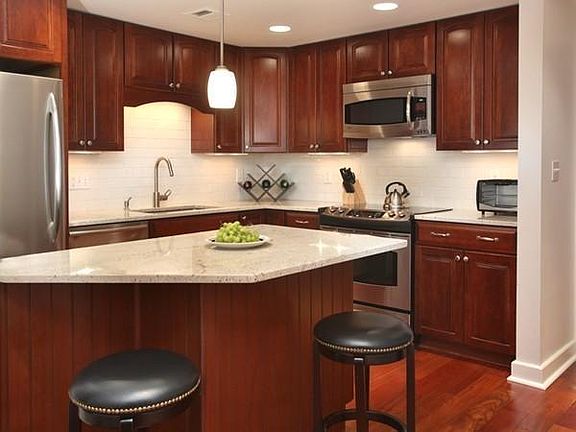 Stainless fridge, dishwasher, range and microwave. Quartz countertops.