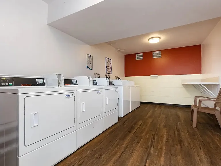 on site laundry room. with 3 washers and 3 dryers. uses card system.