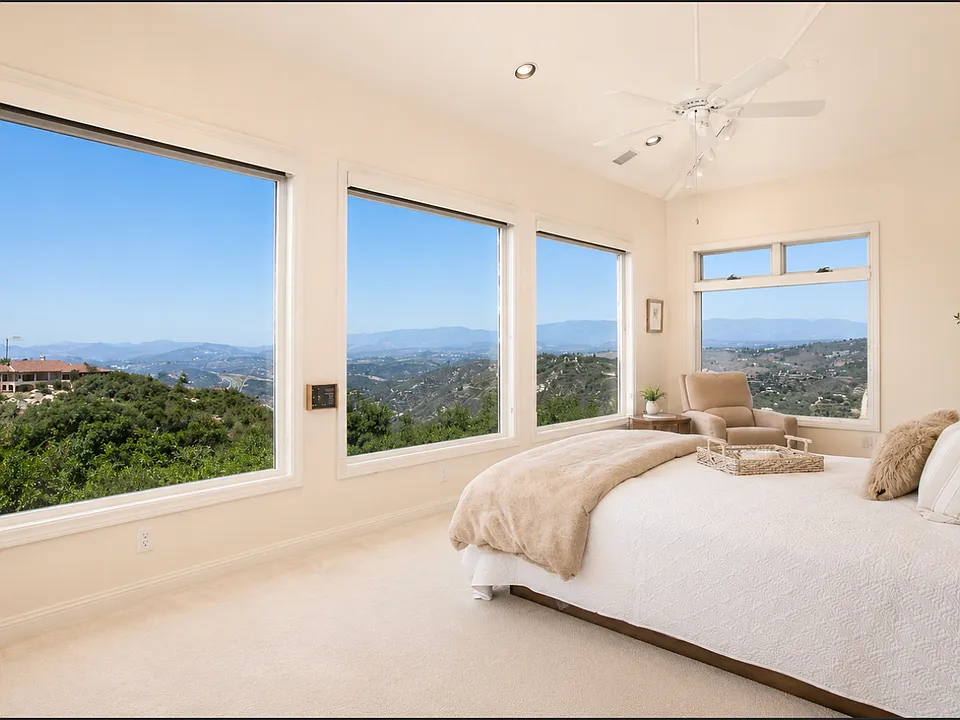 Relax in your primary suite and savor incredible panoramic views spanning from the mountains to the ocean, offering a vantage point that rivals the view from an airplane at over 1,000 feet in the air.