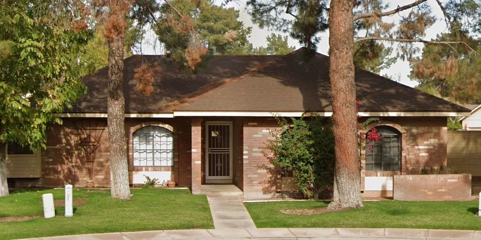 Front of home. Brick exterior keeps home cool.