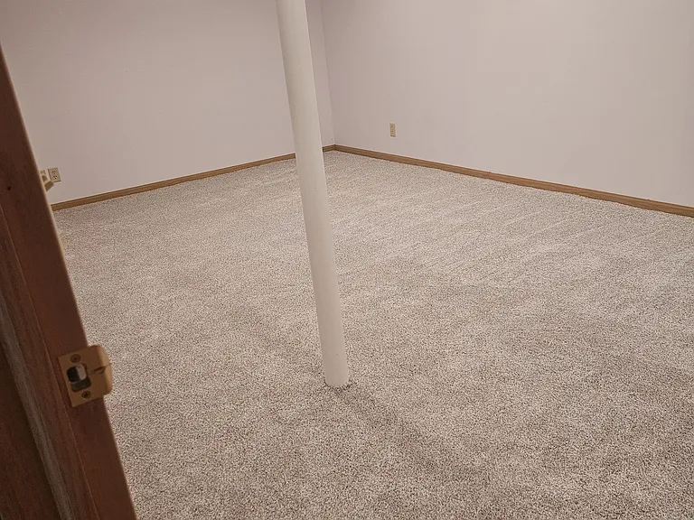 Large finished bonus room with closet in basement