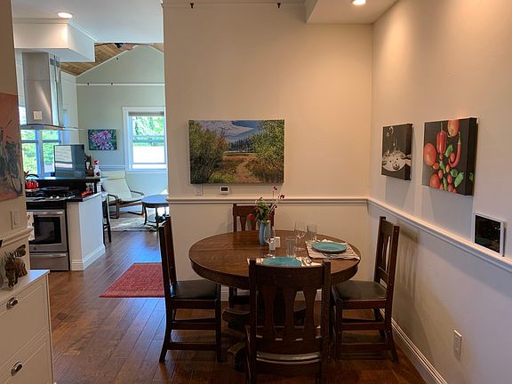 Dining area open to kitchen and den/ family room