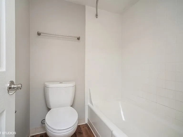 Toilet room with tiled shower