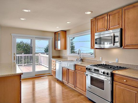 Watch the ferrys while you cook through oversized window above sink