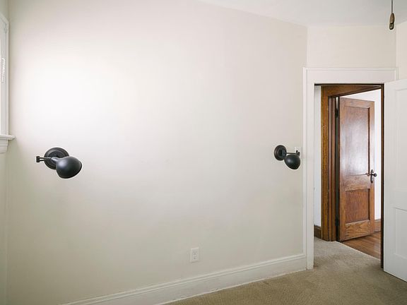 Front bedroom with wall lights. Great for reading in bed.