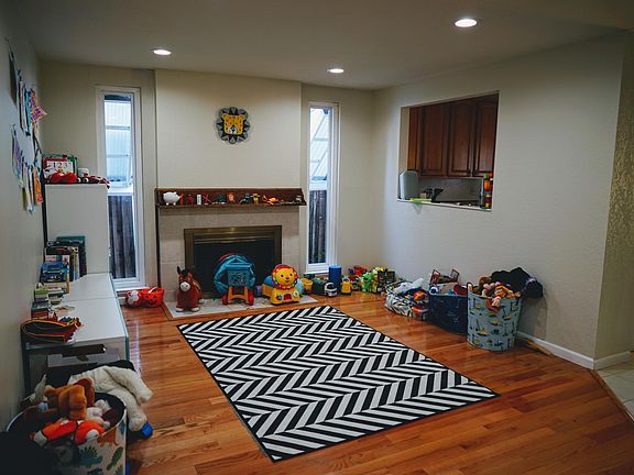Family Room with Fire place and a open plan with breakfast nook and kitchen
