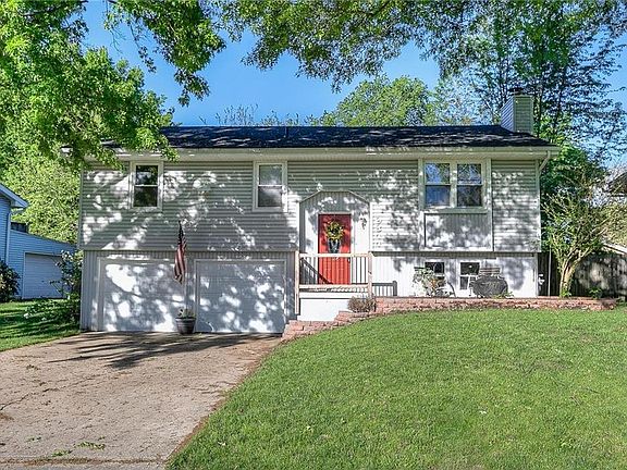 Vinyl Siding, newer windows, newer garage doors, nice landscaping.