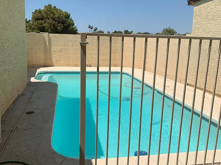Private pool in back yard with patio.