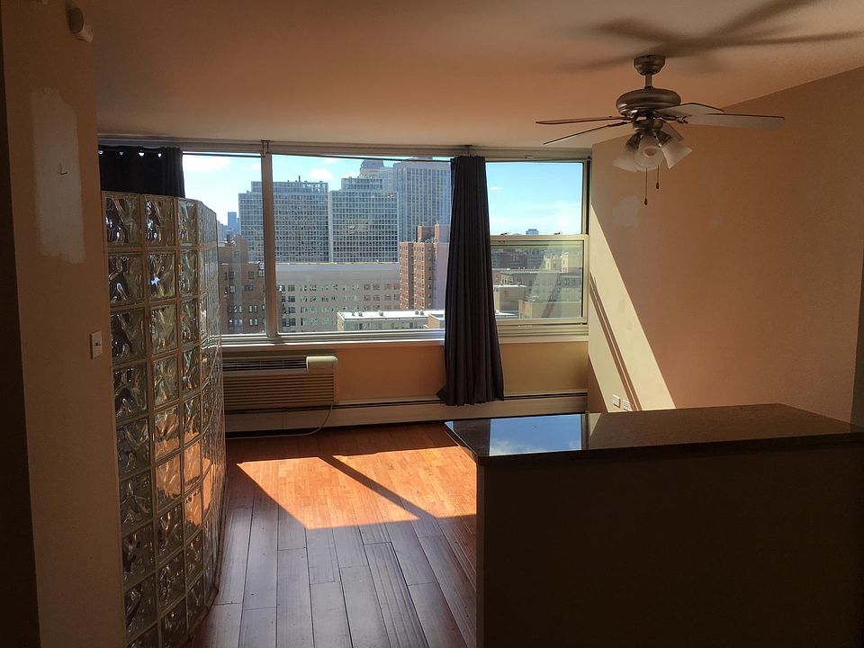 Living area, glass block obscures bedroom