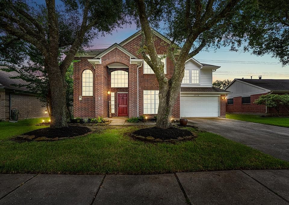 Welcome to your future home at 19714 Glenfinch Lane in the established community of Bridgestone West! This stunning twilight view of the home shows off the many large windows we know bring in tons of natural light!