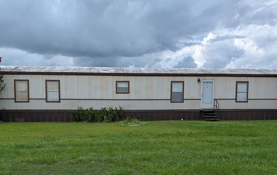 Front exterior with large front yard