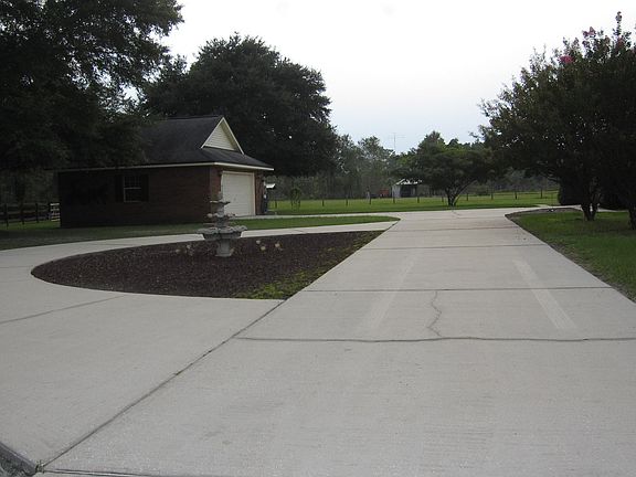 Driveand View of His Garage