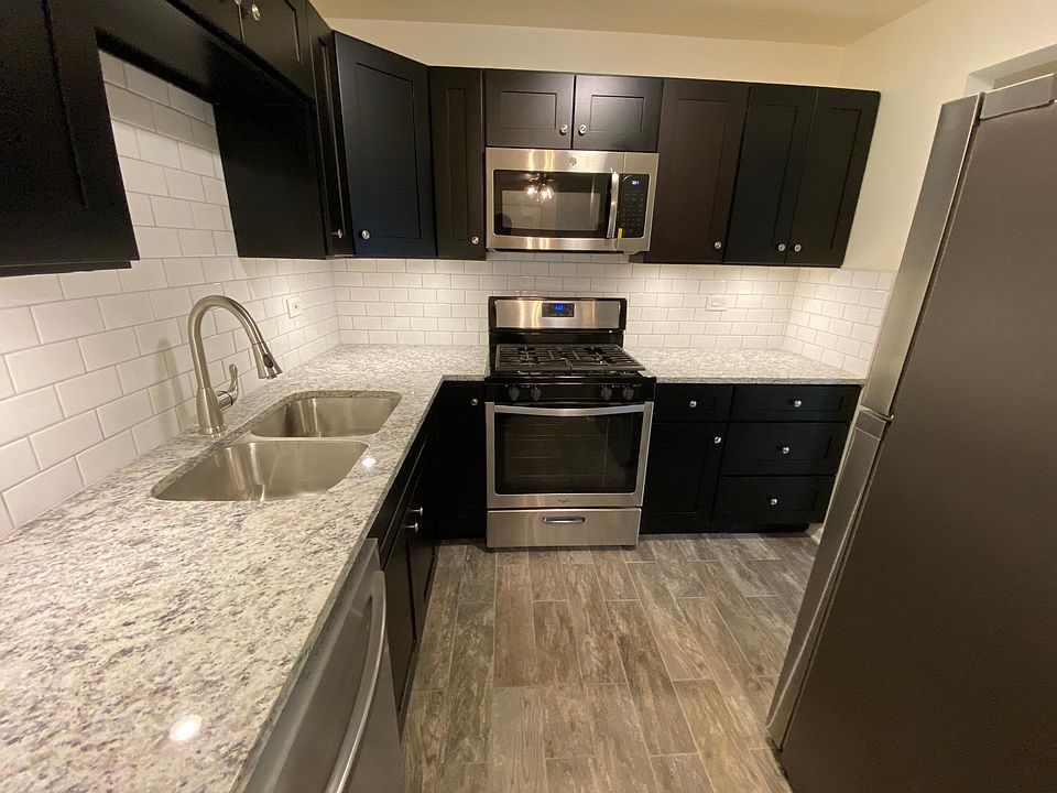 Brand new kitchen with stainless steel appliances