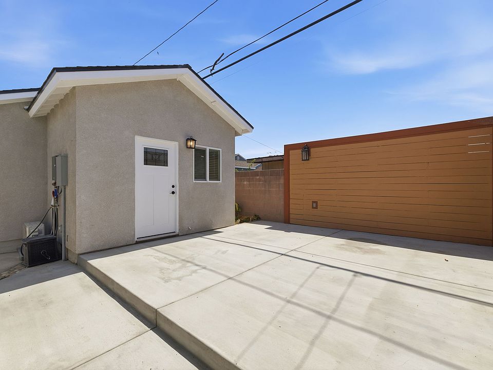 Front of home with full patio