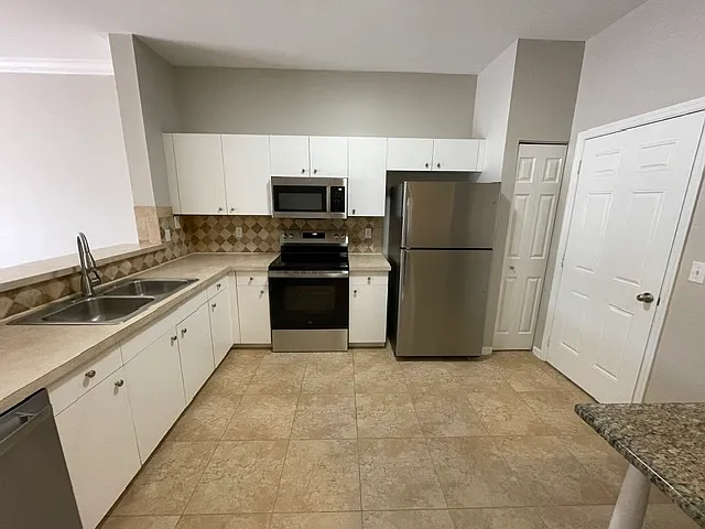 Kitchen - Door From Garage - Pantry Closet