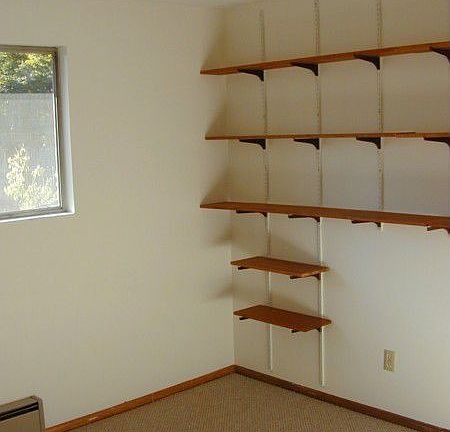 Third bedroom with shelving. Could be used as office.