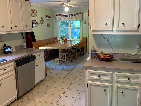 Kitchen with lots of cabinet space and built in seating in the eat in area.