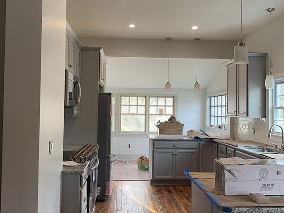 Kitchen with under counter seating (up to 8) and room for a table.