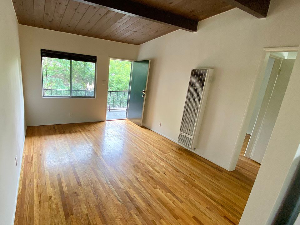 Living room with architectural ceilings
