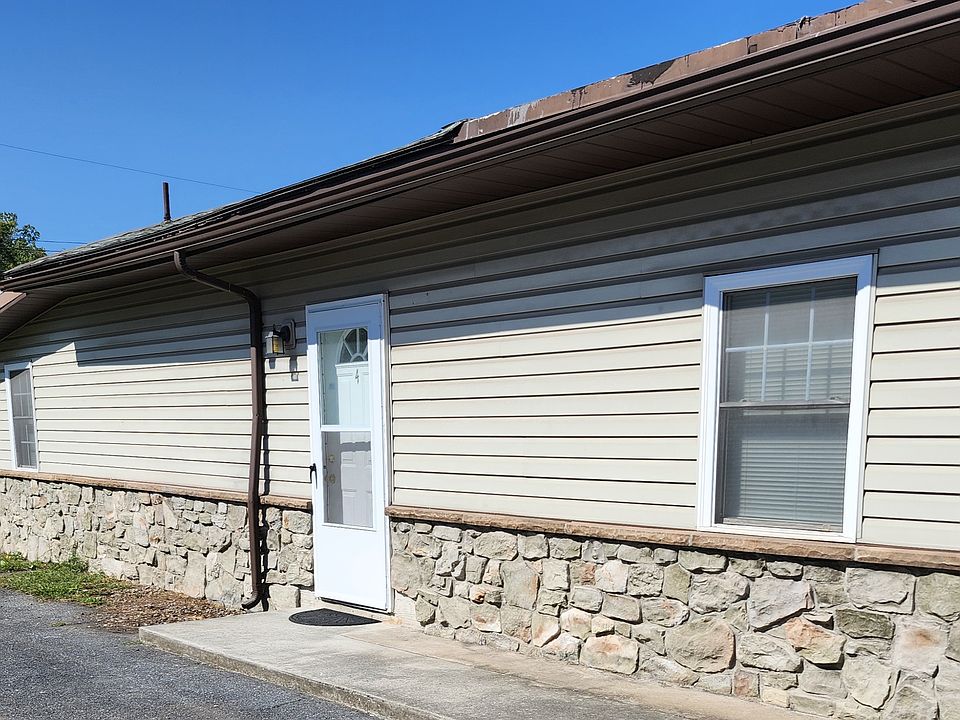 Apartment entry and parking area.