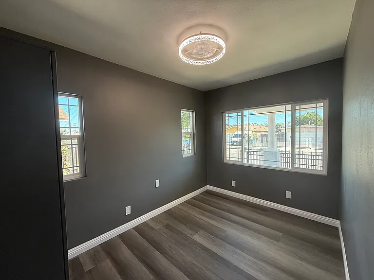 Bedroom comes with wardrobe for tenants' convenience! All new windows and lighting fixture with fan!