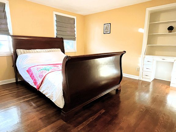 One bedroom features an antique wooden sleigh bed.