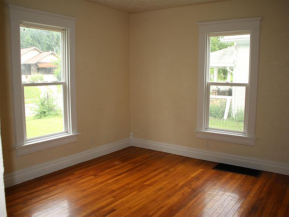 Second living area with nice wood flooring.