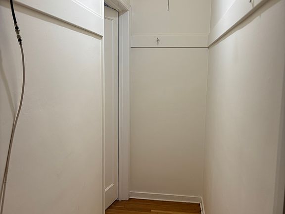 Walk-thru closet from the entryway