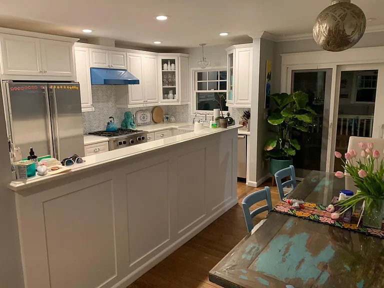 Custom kitchen. Custom colored stove and microwave that matches the backsplash. The backsplash is cut out terra cotta tiles that are hand painted. French door refrigerator.