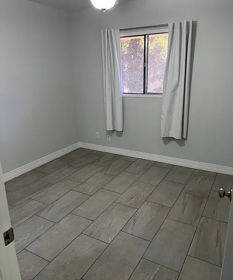 Second Floor Second (2) Bedroom, Walk in Closet. Brand New Tile and Grout, New Baseboard Molding, New Curtains, Ceiling Fan with Light.
