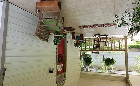 Covered front porch..great for relaxing and enjoying nature!