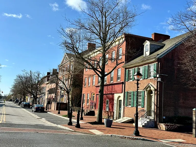 Tree-lined High Street setting with beautifully preserved historic architecture, offering a unique and character-rich living environment.